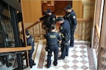 Police respond to protestors inside Portland City Hall.