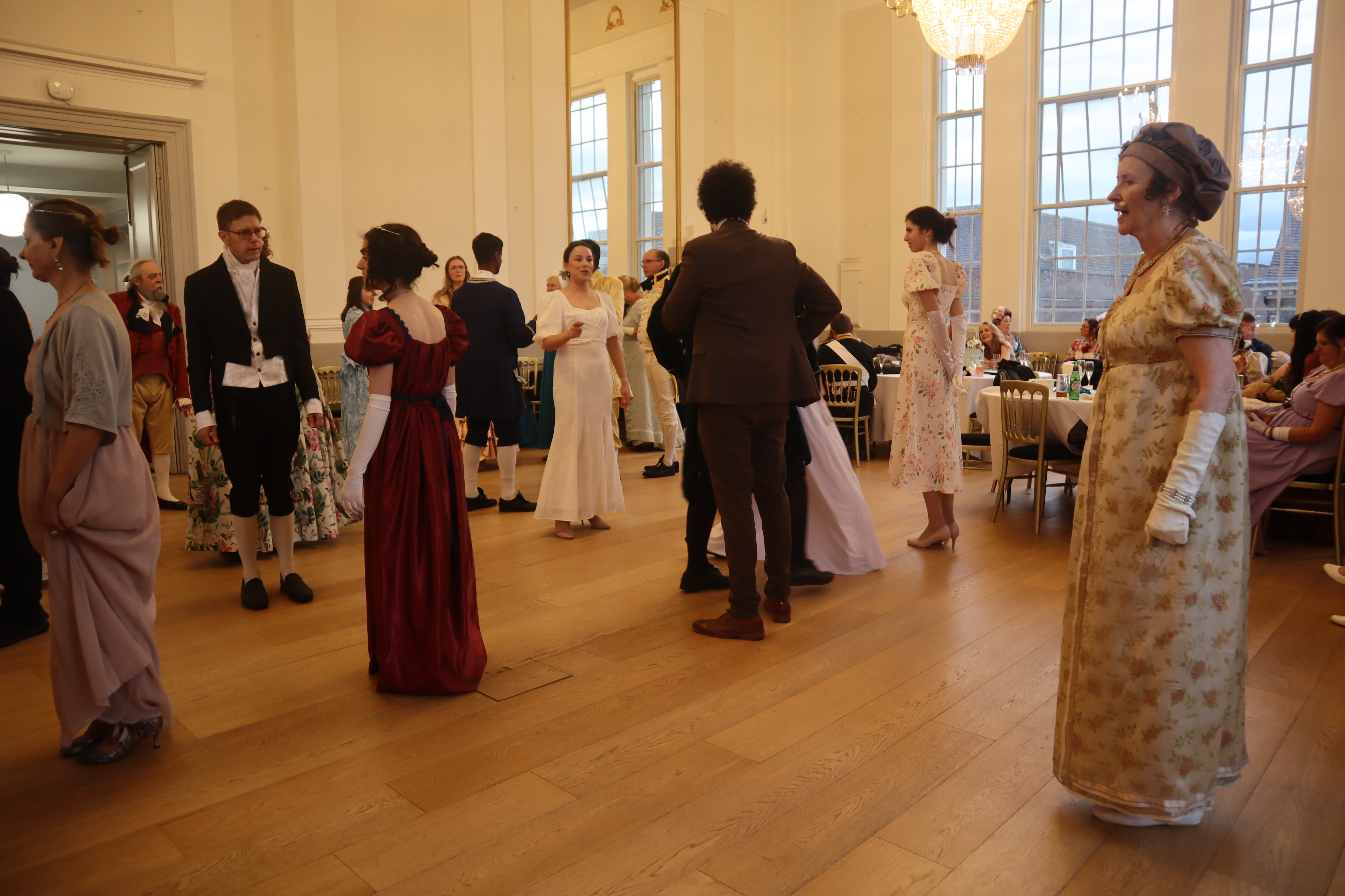 Dance teacher Libby Curzon, from 'Mrs Bennet's Ballroom', teaches attendees period dances at a Georgian Costume Ball to celebrate 250 years since Jane Austen's birth. St Albans Museum and Gallery, England, June 7, 2025.