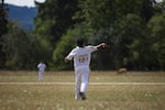 Lokesh Popli flings the ball back into the field. He says few things will keep he and others from playing the sport they grew up loving.