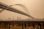 In this file photo pictured on Sept. 10, 2020, smoke obscures the hills and buildings normally visible in downtown Portland.