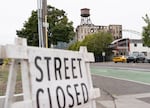 The street in front of Centennial Mills is closed due to the building being unstable in downtown Portland, Ore., on Aug. 14, 2026. The Centennial Mills building has been unstable since it caught on fire in early August.