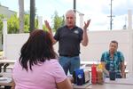 Jim Hoke, who owns Mount Angel Sausage Company with his wife, Robin, speaks with
U.S. Rep. Janelle Bynum, D-Oregon.
