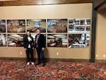 Margaret Simpson, CEO of the Coquille Economic Development Corp., which runs the Mill Casino, poses with Michael Laffey, marketing director at The Mill. The two are in front of renderings of the casino's planned tasting room for Oregon's first tribal run distillery  in Coos Bay on Sept. 12, 2024.