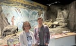 Ann Craig, left, associate director of the Museum of Natural and Cultural History at the University of Oregon, stands next to Todd Braje, the museum's executive director, in front of an interpretative display about Celilo Falls. Over the years, the MNCH has incorporated Indigenous perspectives and staff to help with their exhibits.