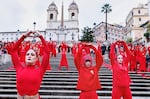 Activists perform on the occasion of the International Day for the Elimination of Violence against Women, in Rome, on Tuesday.