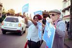 Bernie Sanders fans wave signs outside the new Bernie Sanders campaign headquarters in Portland on April 6, 2016.