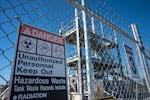 Caution signs warn of radioactive materials at the Tank-Side Cesium Removal System process enclosure outside AP Tank Farm on the Hanford Nuclear Reservation, Sept. 24, 2024. Amazon announced in October that it plans to build nuclear reactors in southeast Washington that would power its data centers in Umatilla and Morrow counties, but many tribes and environmentalists are against it.