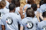 FILE - Hundreds of new volunteers are sworn in for duty at a ceremony, Sept. 12, 2014, on the South Lawn of the White House in Washington. More than 150 AmeriCorps volunteers in Oregon are in limbo this week, waiting to see if their federally-funded programs will continue to exist.