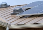 One of 24 energy-efficient and climate-resilient homes constructed by the Confederated Tribes of Grand Ronde, pictured here on Dec. 11, 2023, in Grand Ronde. These homes utilize energy efficient technologies such as solar panels, right, and sun tunnels, center.