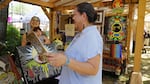 The Native American Arts and Crafts Market at the Oregon Country Fair, July 14, 2024. Left to Right: Arusha Dittmer and daughter; artist Marcy Middleton.