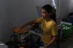 Loirad Ortiz Cedeño cooks during Huerto Callejón Trujillo's "sancocho comunitario" event Saturday in the community of Ponce Playa, Puerto Rico.