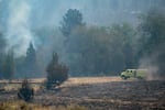 A provided image showing smoky conditions at the Bench Fire as a fire truck drives through the area near Warm Springs, Ore., on July 28, 2026.