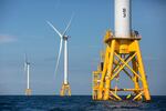 FILE - In this Aug. 15, 2016 file photo, three of Deepwater Wind's five turbines stand in the water off Block Island, R.I, the nation's first offshore wind farm.  Interior Secretary Deb Haaland says the Biden administration will hold lease sales for up to seven offshore wind farms on the East and West coasts and in the Gulf of Mexico in the next four years. The projects are part of the administration's plan to deploy 30 gigawatts of offshore wind energy by 2030,  generating enough electricity to power more than 10 million homes.