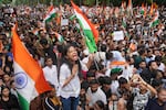 Protesters celebrate after Education Minister Dharmendra Pradhan resigned following nationwide protests as part of the Cockroach Janta Party's protest movement in Mumbai, India, Sunday, July 26, 2026.