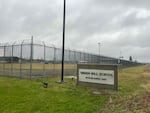 A sign and fence at the Green Hill School for juvenile offenders in Chehalis, Wash.