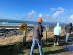 FILE: In this provided photo, whale watchers walk along the coastline at Boiler Bay State Scenic Viewpoint in Oregon on Dec. 28, 2022. The state could be in store for a warmer-than-usual winter.