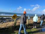 FILE: In this provided photo, whale watchers walk along the coastline at Boiler Bay State Scenic Viewpoint in Oregon on Dec. 28, 2022. The state could be in store for a warmer-than-usual winter.