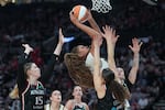 Chicago Sky center Kamilla Cardoso goes to the basket as Portland Fire players defend during the second half of a WNBA basketball game on Saturday, May 9, 2026, in Portland, Ore. (AP Photo/Jenny Kane)