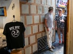 Thor Drake, left, founder of One Moto Cafe in Portland, Ore., talks to a visitor at the cafe's grand opening party on July 26, 2024. One Moto Cafe, a motorcycle-themed cafe, was formerly known as See See Motor Coffee Co.