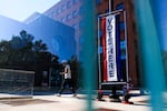 People walk by a polling place at Denver's Central Library on June 30, 2026.
