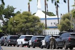Police stage at the scene of a shooting outside the Islamic Center of San Diego Monday, May 18, 2026, in San Diego.