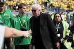 Nike founder Phil Knight walks on the field before an NCAA football game between Colorado and Oregon, Saturday, Sept. 23, 2023, in Eugene, Ore. Though Knight previously tried to buy the Portland Trail Blazers in recent years, he says he now won't.