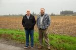 Gary and Matthew Cook stand by the stubble of a corn field on their family farm in Albany, Ore., Jan. 22, 2020. They both described NORPAC's bankruptcy as heartbreaking.