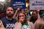 Supporters react during an election night event for Democratic Gov. Tony Evers at The Orpheum Theater on Nov. 8 in Madison, Wisc. Evers defeated Republican challenger Tim Michels Tuesday.