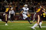 Penn State quarterback Drew Allar (15) runs with the ball during the second half of an NCAA college football game against Minnesota, Saturday, Nov. 23, 2024, in Minneapolis.