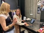 Owner of Garnish Apparel Erica Lurie (left) talks with employee Hadley Walsh about the store's social media strategy on Jan. 22, 2024, in Portland. The store had to close for nearly a week due to the ice storm.