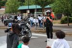 A Portland police officer smiles at children marching in the Juneteenth parade on Martin Luther King Boulevard.