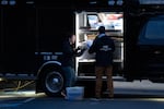 FBI Investigators work on the scene near the 10200 block of Southeast Main Street in Portland where two people were shot and wounded Thursday, Jan. 8, 2026, by U.S. Border Patrol earlier that day.