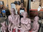 Talicia Brown of Black Cultural Initiative stands behind the monument, "Crossing the Bridge" by local artist Percy Appau, on Friday, Feb. 13, 2026. The piece was shown to the media and relatives of the five Black families at the Reinmuth Foundry.