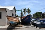 Fishing boats lie in the middle of the street for protection from Hurricane Beryl in Kingston, Jamaica, Tuesday, July 2, 2024.