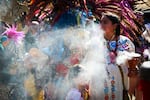 The Mitotiliztli Yaoyollohtli Aztec dance company lines up for a march for Santos Rodriguez, a 12-year-old shot by a Dallas police officer in 1973, during a 50th anniversary commemoration on July 23, 2023, in downtown Dallas. Full story here.