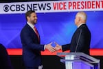 Minnesota Gov. Tim Walz and Ohio Sen. JD Vance shake hands after the vice presidential debate at the CBS Broadcast Center on Tuesday in New York City.