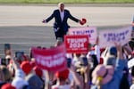 Former President Donald Trump walks across the tarmac as he arrives to speak at a campaign rally at Waco Regional Airport on March 25, 2023, in Waco, Texas.