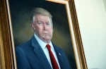 FILE - President Donald Trump's portrait hangs in the Colorado Capitol after an unveiling ceremony, Aug. 1, 2019, in Denver. (AP Photo/Thomas Peipert, File)