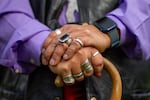 Ed Edmo’s hands are adorned with jewelry, many are repurposed silver spoon handles that he now wears as rings.