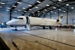 This photo shows a chartered cargo plane inside a hangar at the airport in Thief River Falls. The plane is white and has only one window along the side.