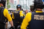 Portland police officers on bicycles at a white supremacist rally in Portland, Ore., Saturday, Aug. 17, 2019. The rally organized by the Proud Boys, labeled a hate group by the Southern Poverty Law Center, attracted militia members, white supremacists and neo-Nazis and carried the potential for violence.