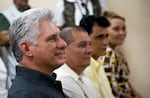 FILE - In this Jan. 16, 2020 file photo, Cuba's President Miguel Diaz-Canel, left, attends a meeting in an art school during a tour in Las Tunas, Cuba. On Monday, April 19, 2021, Cuba's Communist Party congress chose Díaz-Canel to be its leader, adding that post to the title of president he assumed in 2018, replacing his mentor Raul Castro and sealing a political dynasty that had held power since the 1959 revolution.