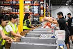 Volunteers assemble relief packages for Hurricane Melissa at the Global Empowerment Mission headquarters in Miami, Florida, on Oct. 27, 2024. Hurricane Melissa threatened Jamaica with potentially deadly rains after rapidly intensifying into a top-level Category 5 storm, as residents scrambled for shelter from what could be the island's most violent weather on record.