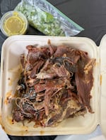 Meat from the Barbacoa is sold by the pound the next day in to-go containers and is accompanied with salsa and a bag of cilantro and onions.