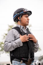Martin Garcia (40), a jockey from Veracruz, Mexico, discusses his experiences riding in competitions on the backside of a horse racing track in Louisville, Ky., on April 30, 2025. Garcia entered the country 15 years ago and will be competing in his fourth Kentucky Derby.