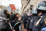 Students and pro-Palestinian activists face police outside of Columbia University to protest the university's stance on Israel on April 18, 2024 in New York City. The protests come after numerous students were arrested earlier in the day after setting up tents on the university lawn in support of Gaza.