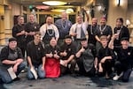 Culinary students from the Siletz Valley School surround Chefs Jack Strong, Rob Kinneen, Nephi Craig, Patrick Clarke and Kaylee Martin after a First Foods dinner at the Allison Inn & Spa in Newberg, Ore. on Nov. 22, 2025.