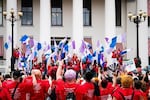 Advocates outside Florida's historic Capitol wave drag pride flags during the Drag Queens March in 2023.