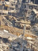 Israeli soldiers continue search operations for the remains of an Israeli hostage in a mass grave located in the Tuffah neighborhood in Gaza City, Gaza Strip, on Monday. Tanks and heavy machinery belonging to the Israeli army are observed operating in the area during the ongoing excavation and recovery efforts.
