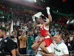 Algeria's Imane Khelif celebrates winning the gold medal with her coaches Mohamed Chaoua and Mohamed Al-Shawa after the Boxing Women's 66kg final against Liu Yang of China on Friday.